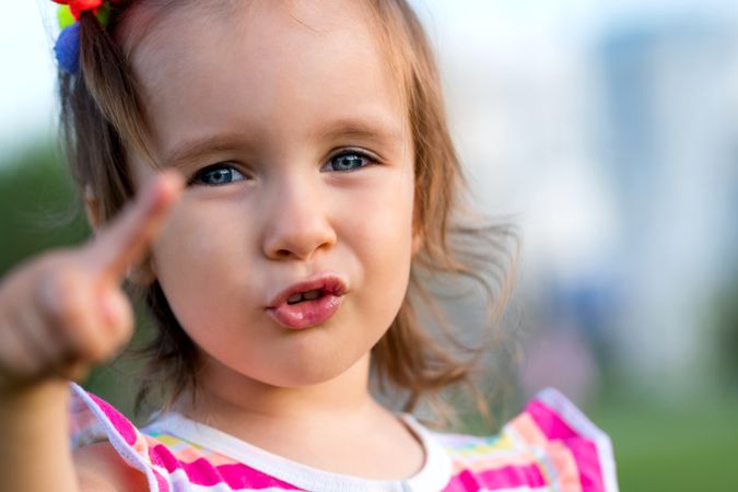 Portrait of toddler enjoying summer outdoors
