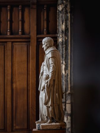 Ancient sculpture in one of the churches of Paris. Antique art.