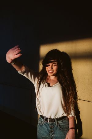 Smiling woman in spot of light