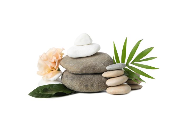 Stones, flower and tropical leaves, isolated on plain background