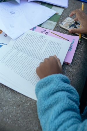 Cropped image of Black child studying