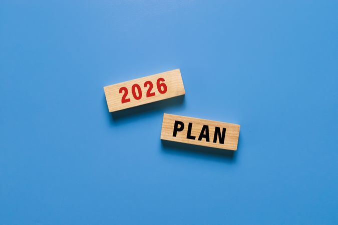 2026 plan text symbol on wooden blocks isolated on blue background