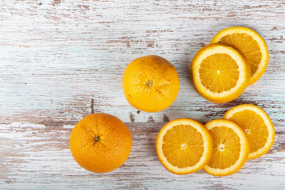 Sliced oranges on the table.