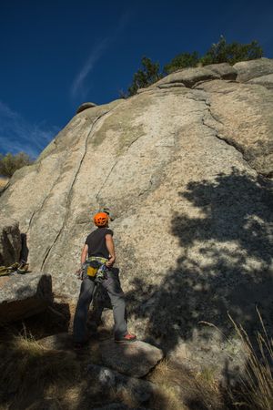 A rock climber is staring at the mountain