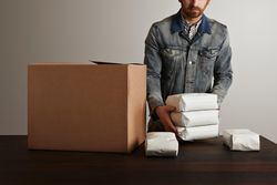 Man preparing coffee beans for shipment