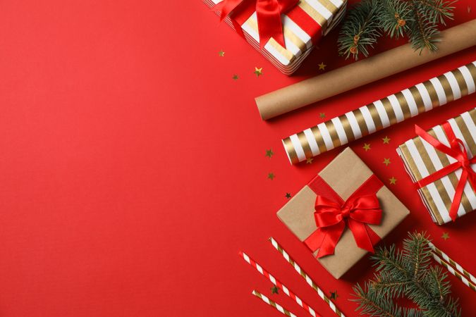 Composition with Christmas accessories on red background, space for text