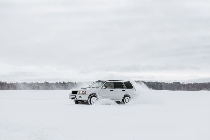 Car driving on snow field