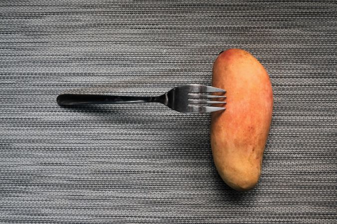 Fork leaning on a mango