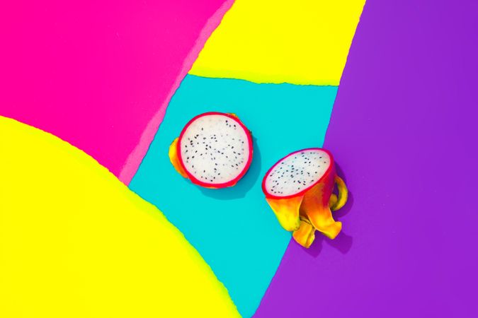 Draganfruit on pattern of ripped paper in vivid colors