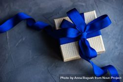 Gift box concept with blue ribbon 5qkEgJ