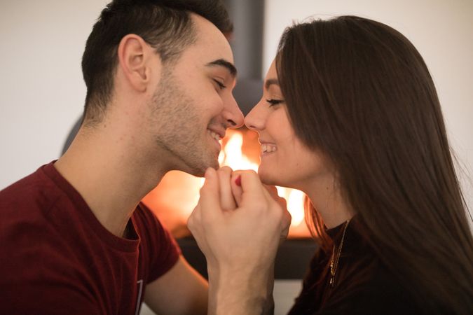Couple sitting near fireplace