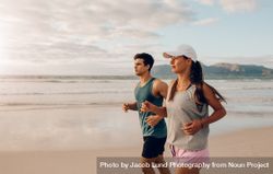 Young man and woman jogging in morning 0KMVWV