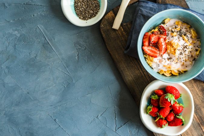 Top view of traditionally healthy breakfast with chia and strawberry with copy space