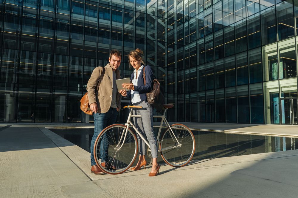 Businesspeople talking on street after work