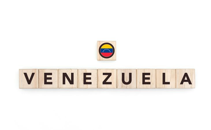 Wooden blocks bearing the name and flag of Venezuela. Latin and South American Culture, national identity, travel, and geography in a copy space design.