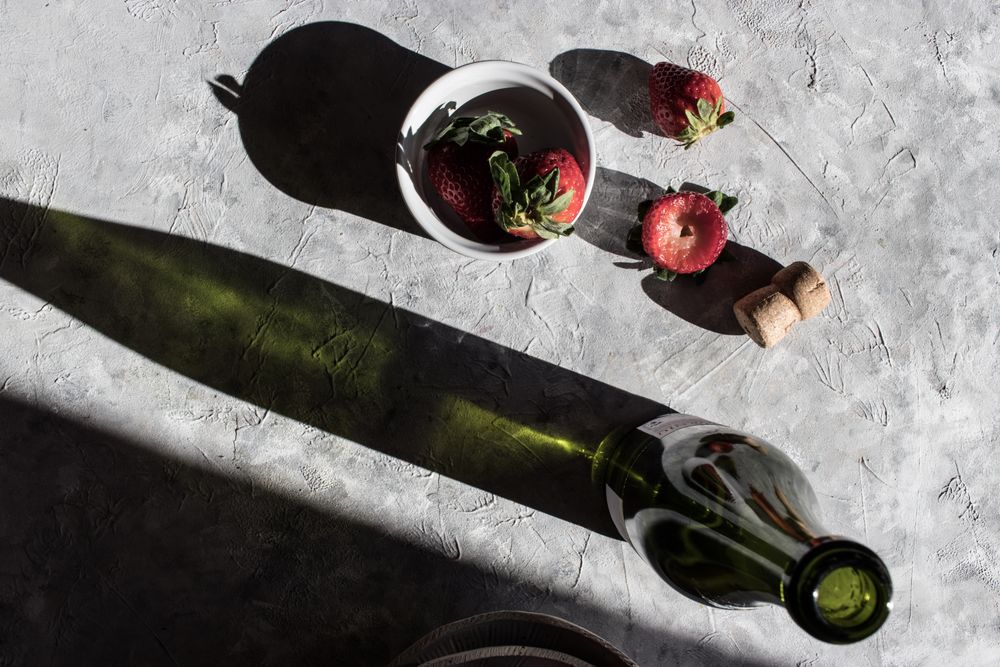 Strawberries near bottle of drink