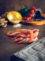 Tasty raw shrimps on table