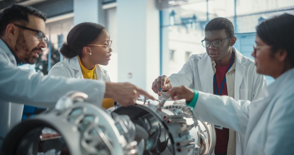 Multiethnic Scientists Developing a New Electric Motor in a Research Facility