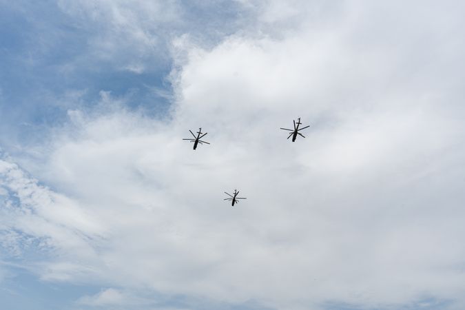 Helicopters fly in the sky of Tbilisi city