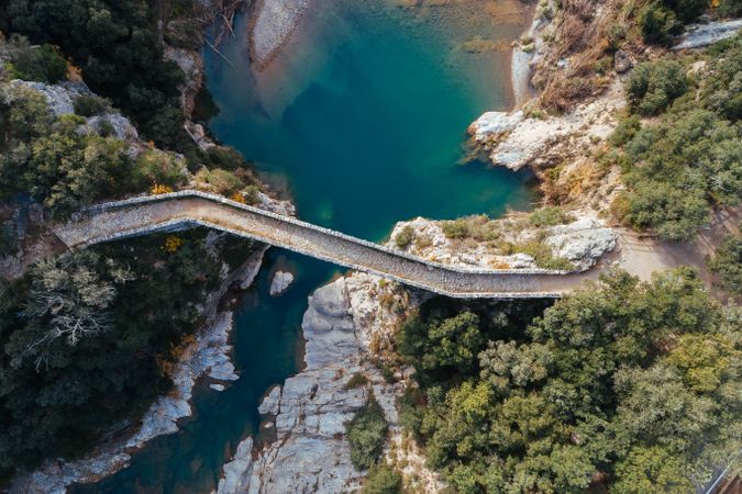 Old bridge over small tranquil river