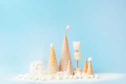 Christmas trees made form waffle cones and marshmallows with powdered sugar