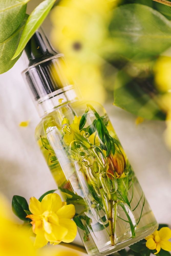 Essential oil, with flowers and natural herbs