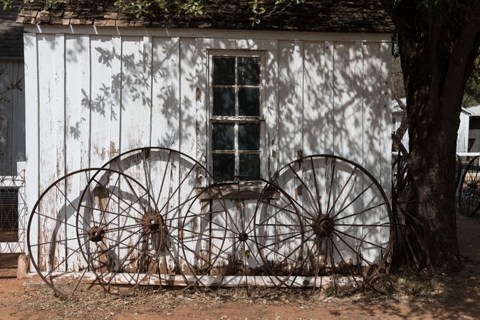 Wagon wheels against the Buffalo Gap Historic Village in the unincorporated Taylor County, Texas