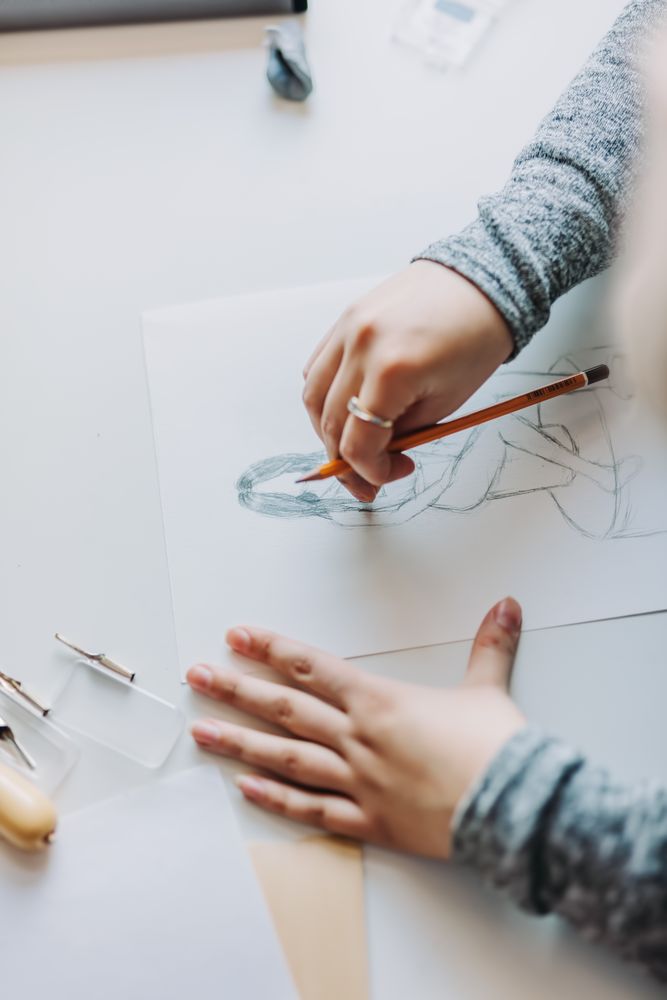 Woman doing linearity and first sketches in office