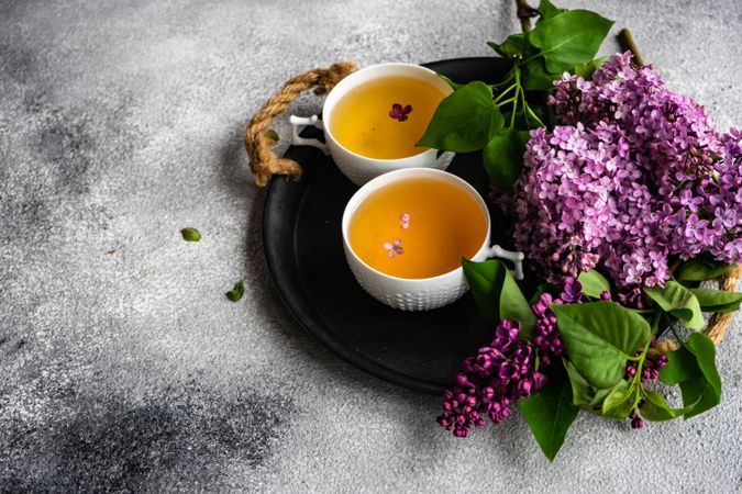 Tray of tea with delicate tea and pink flowers
