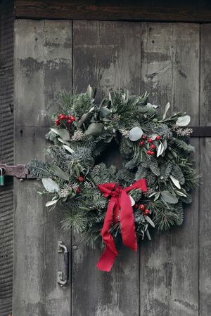 Christmas wreath, garland of fir, pine tree branches and red berries