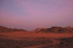 Sunset sky over rocks and valley