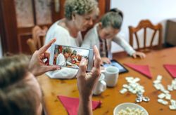 Grandmother and granddaughter play a game on the tablet