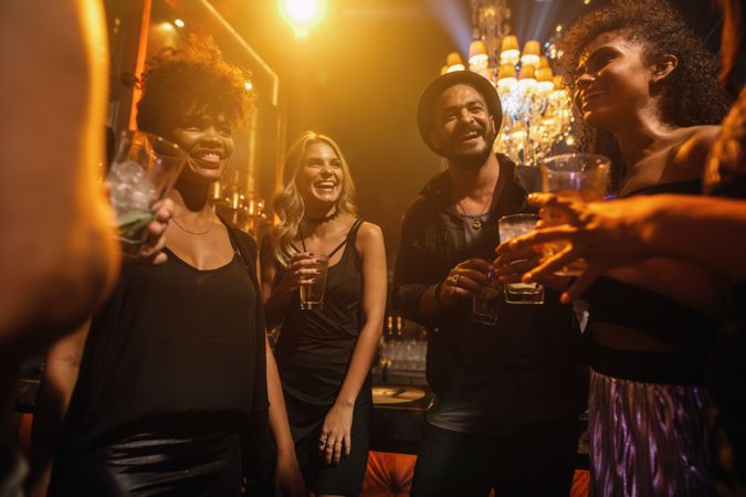 Friends having cocktails in nightclub
