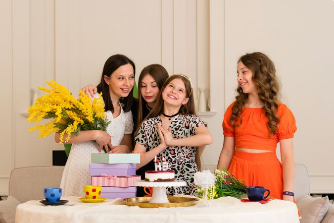 Family celebrating birthday girl