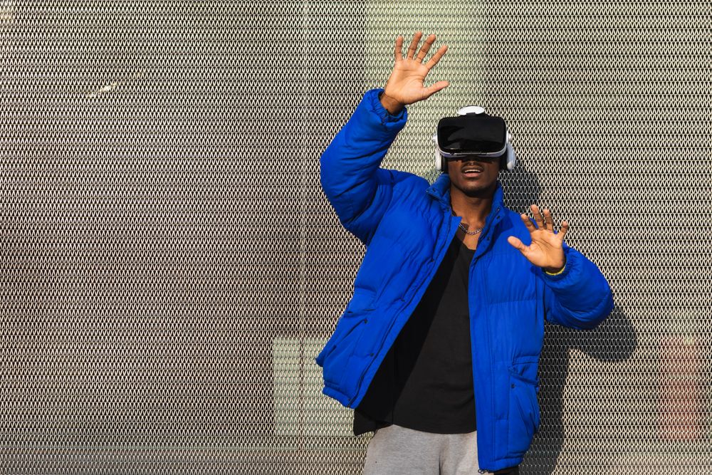 Black man experiencing virtual reality in city