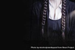 Detail of braids and a white shirt of a woman with a gothic and dark look, perfect for Halloween 5Xrr7r