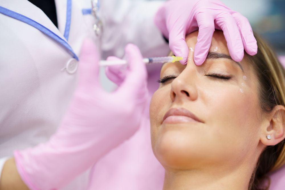 Woman having botox treatment on face in medical spa