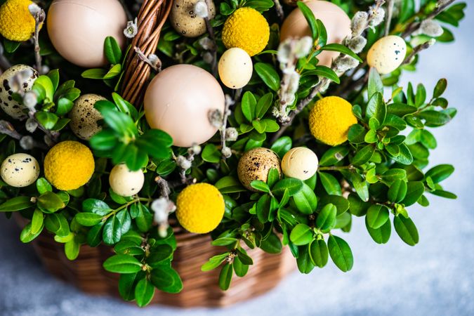 Eggs & flowers in decorative Easter basket
