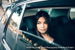 Female business executive traveling by a cab 5o2x80