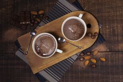 Top view of hot chocolate and almonds