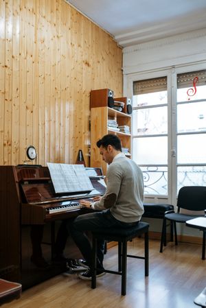 Man playing piano in studio