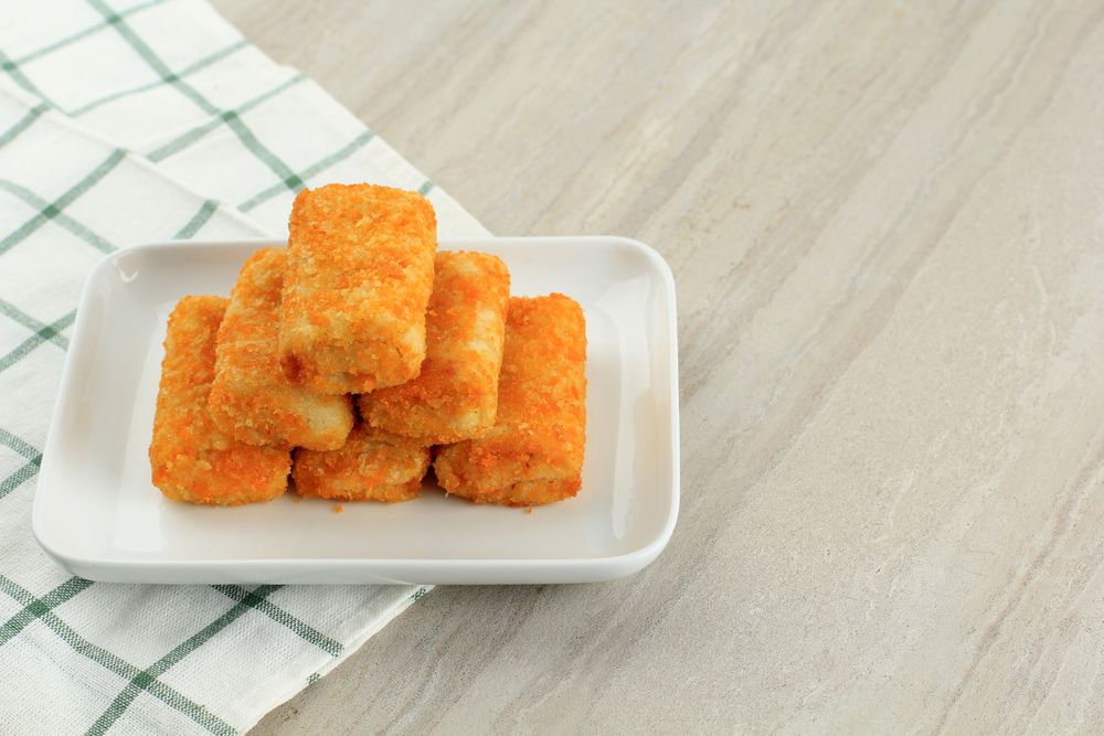Pile of risol mayo keju, thin crepes rolled with egg and sausage inside