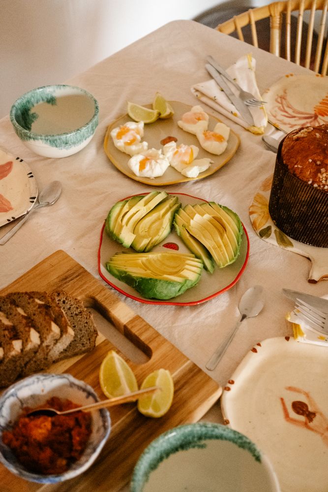 Plate of sliced avocado and poached eggs for breakfast