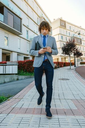 Businessman walking down the street