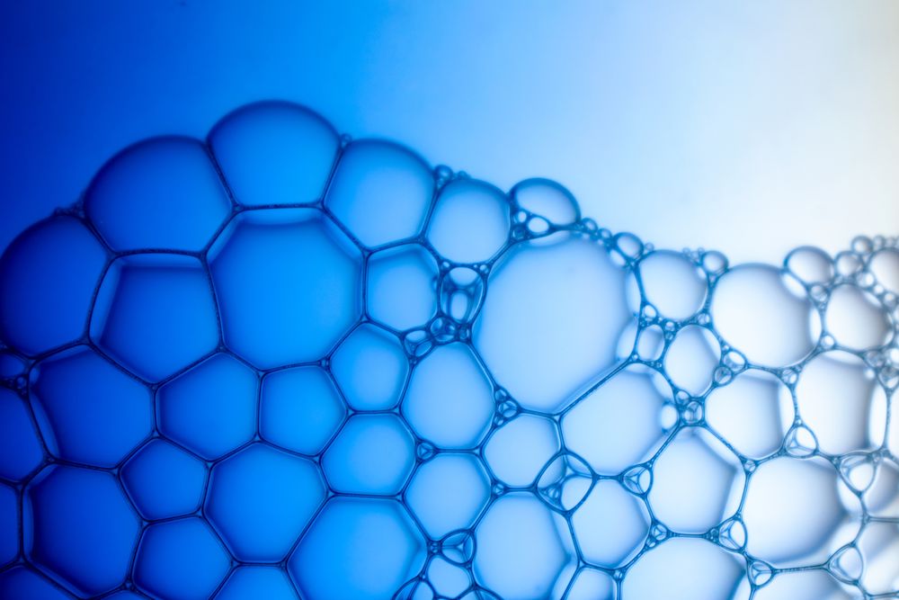 Abstract background bio technology, macro photography foam and water with gradient background. Molecule multicolor backgorund