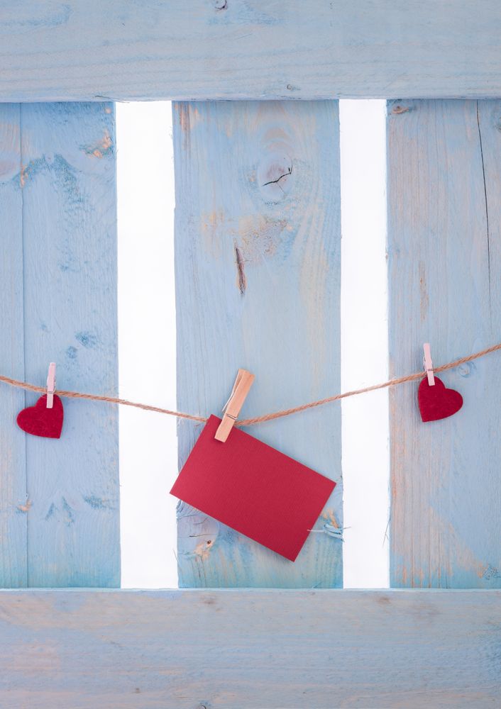 Red hearts and a message card with copy space