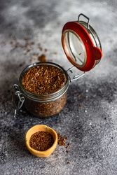 Organic food concept of pot of flax seeds