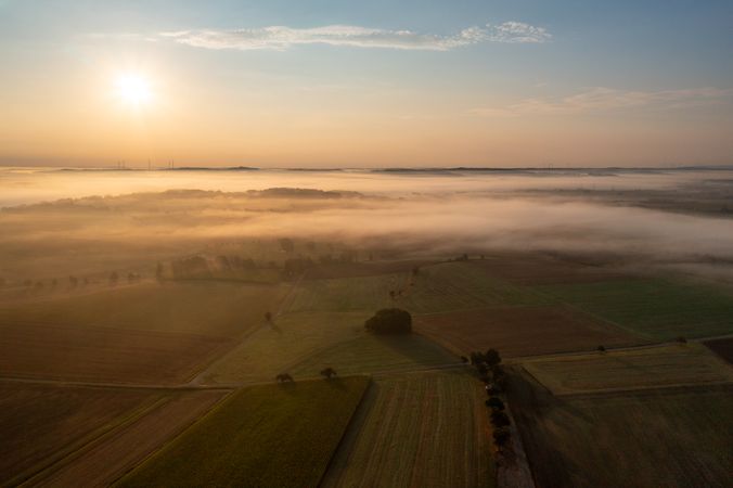 Aerial scenery at sunrise with foggy landscapes in rural Germany