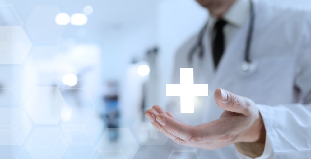 Doctor Reveals Medical Cross Icon in Palm