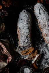 Pieces of Stollen near sieve and autumn leaves